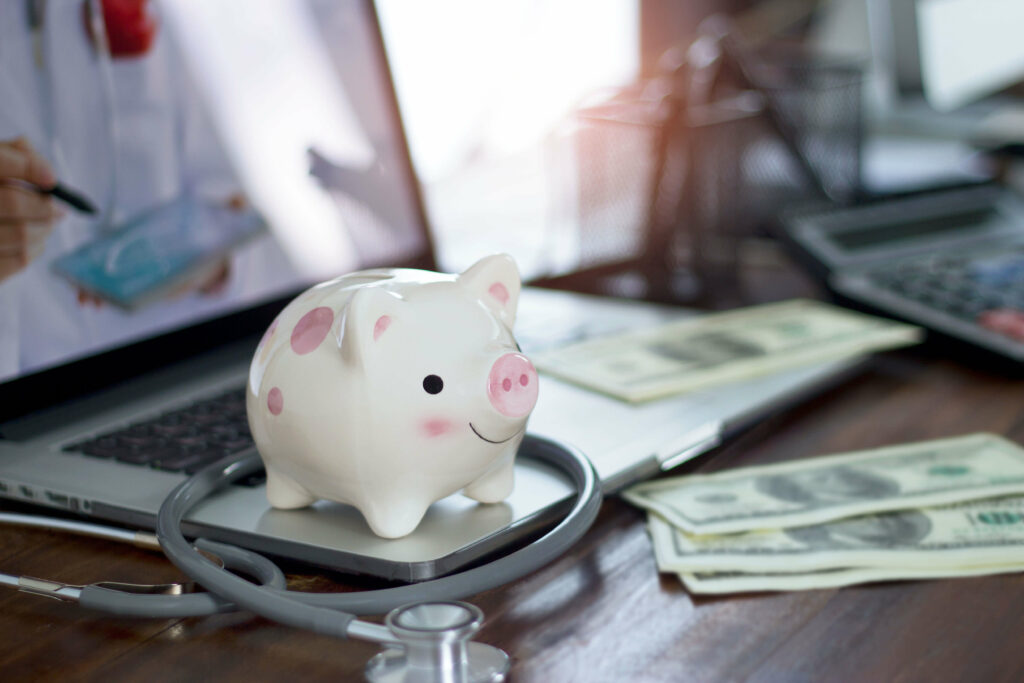 piggy bank and stethoscope health savings